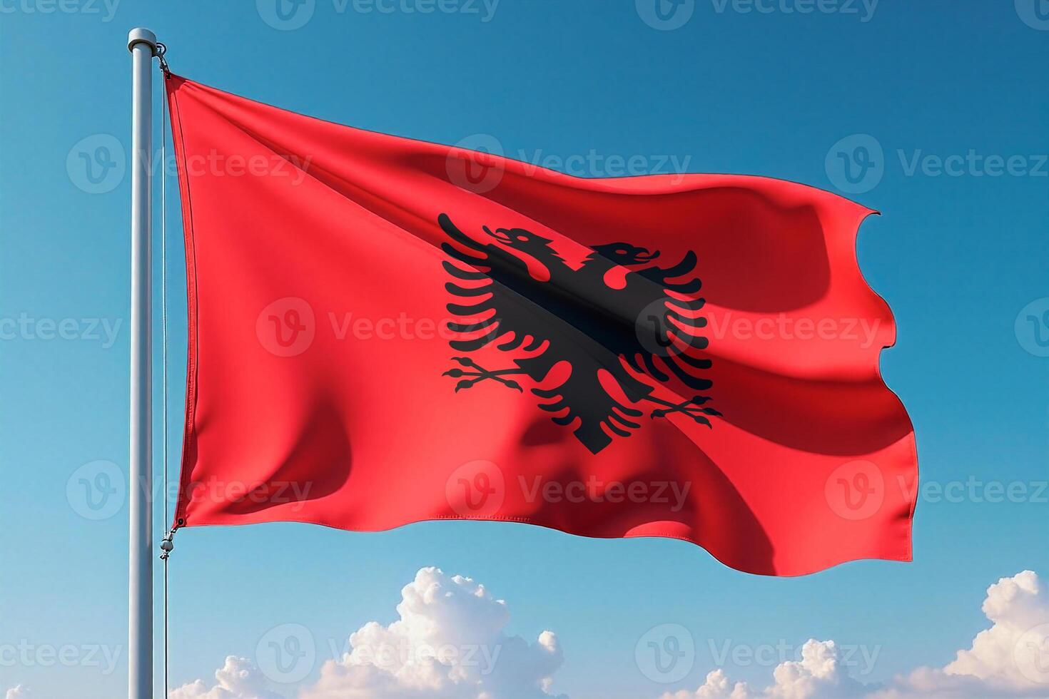 Albania Flag Waving Against Clear Blue Sky photo