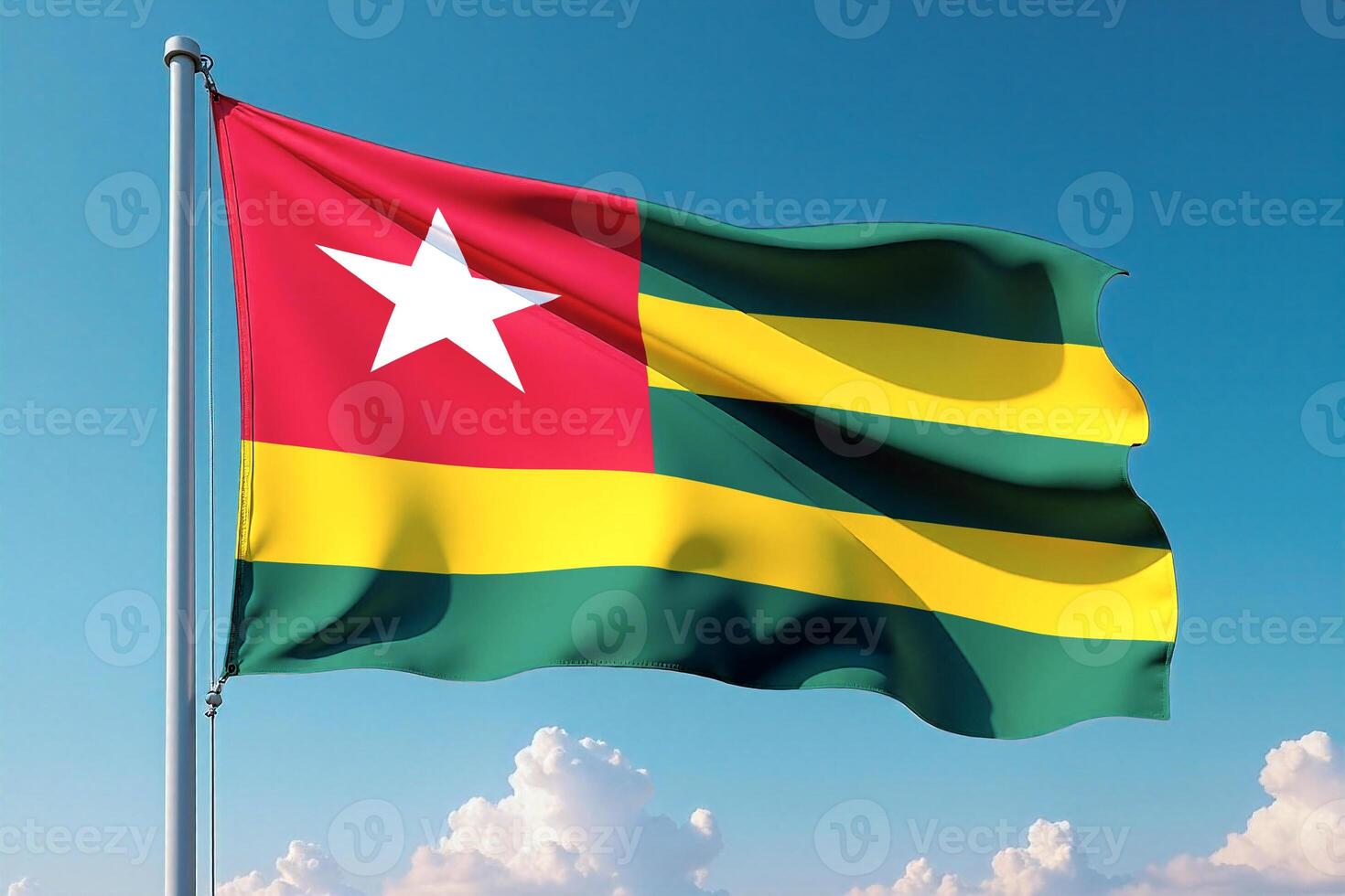 Togo Flag Waving Against Clear Blue Sky photo