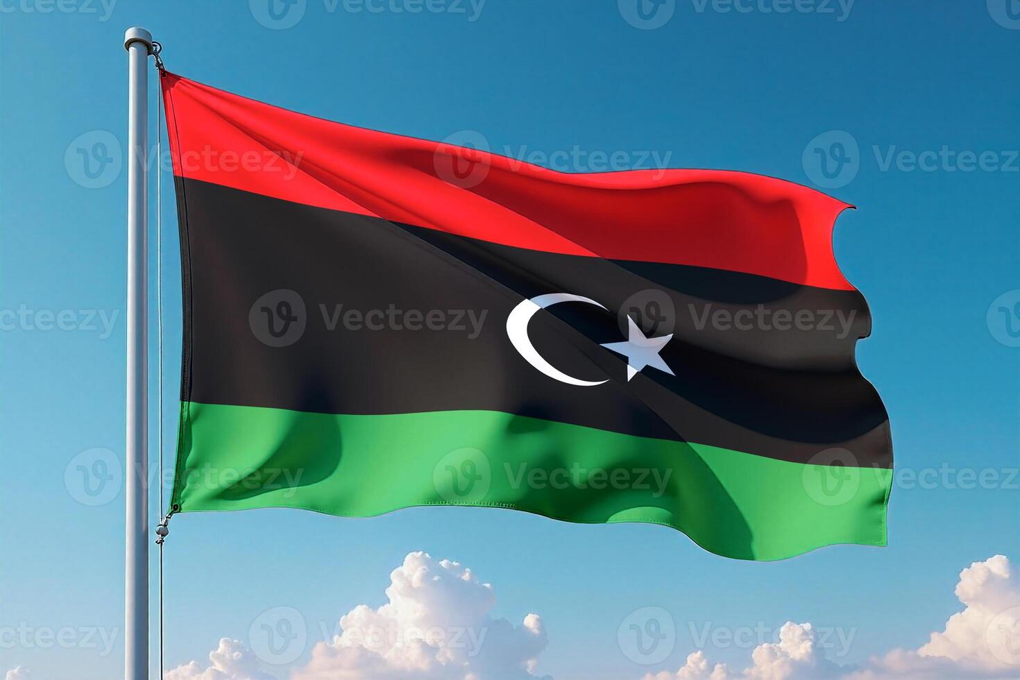 Libya Flag Waving Against Clear Blue Sky photo