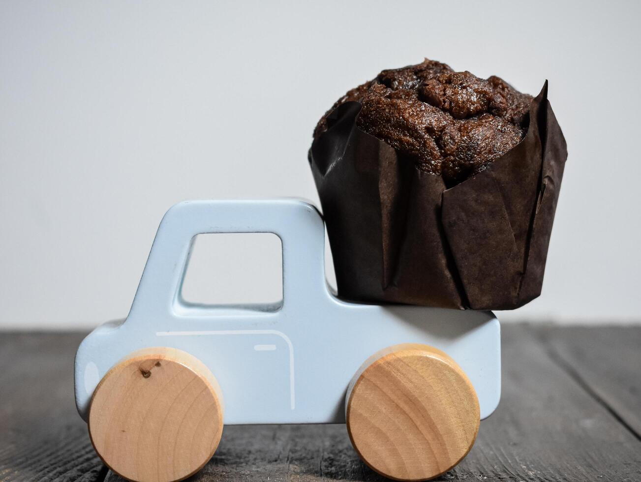 Chocolate muffins isolated on Toy Car photo