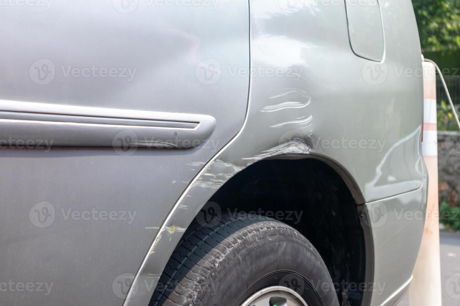 View of scratched or grazed car side body after a minor accident photo