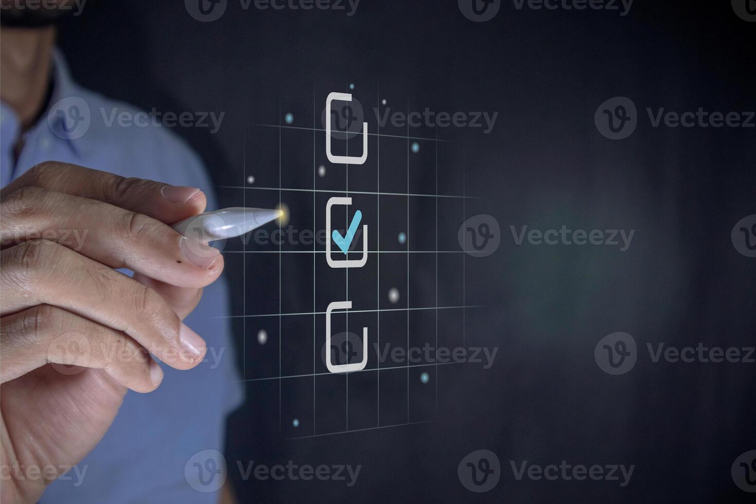 Hand holding a pen ticking a blue checkmark on a box on virtual screen. Assessment, questionnaire, online survey or business evaluation concept. photo