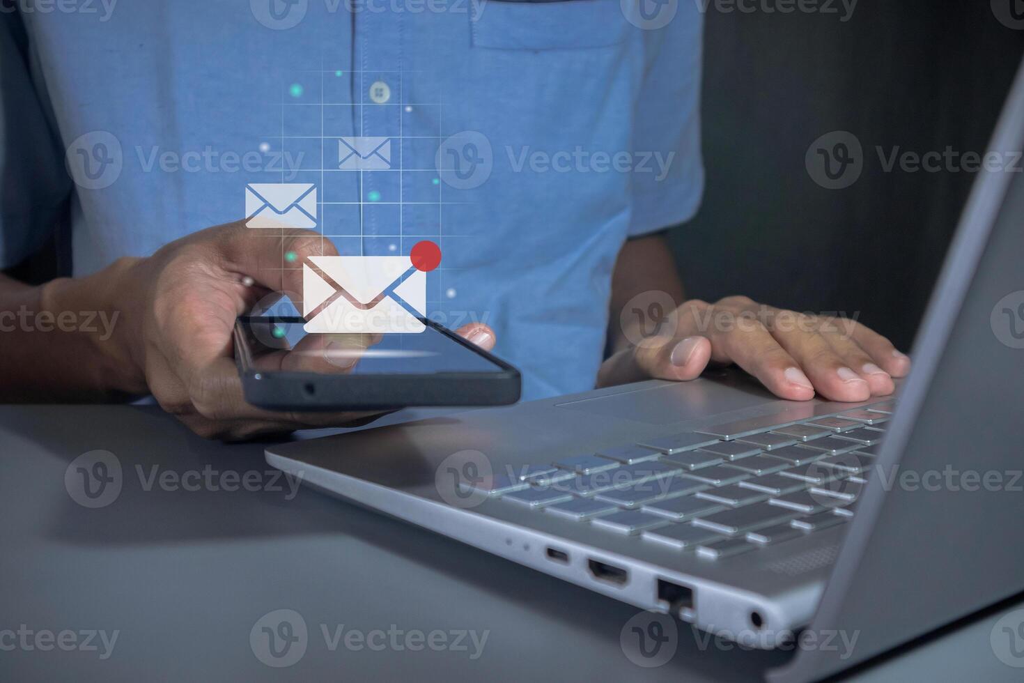 Man holding a mobile phone with email notification, new message or social media notification photo