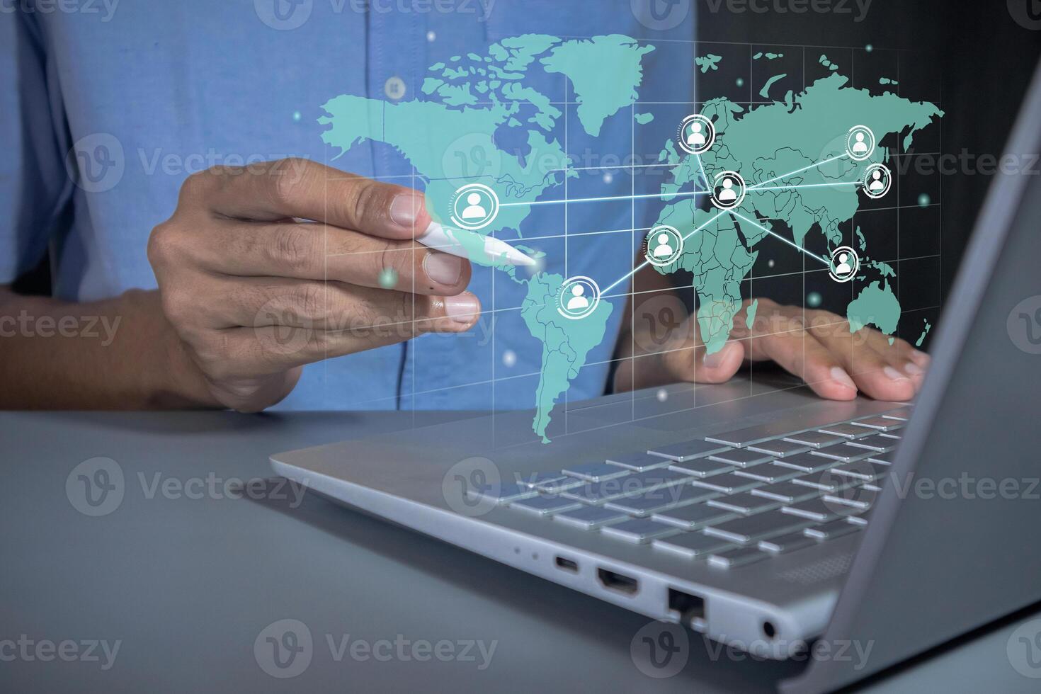 Man with global communication network on virtual screen. Global business or worldwide business concept. photo
