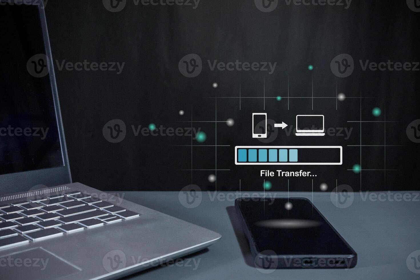 Transfer files from mobile phone to laptop. Backup, Copy file and media or exchange data concept. photo