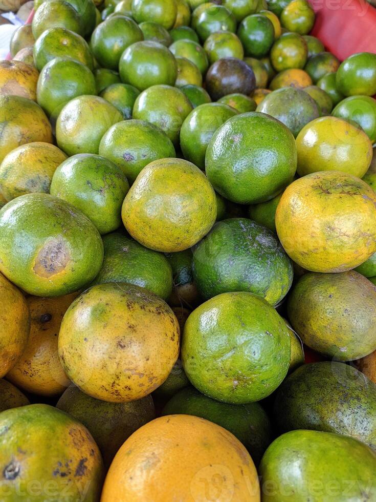 Orange fruit - large amounts of orange fruit, fresh orange fruit, orange fruit in a basket photo