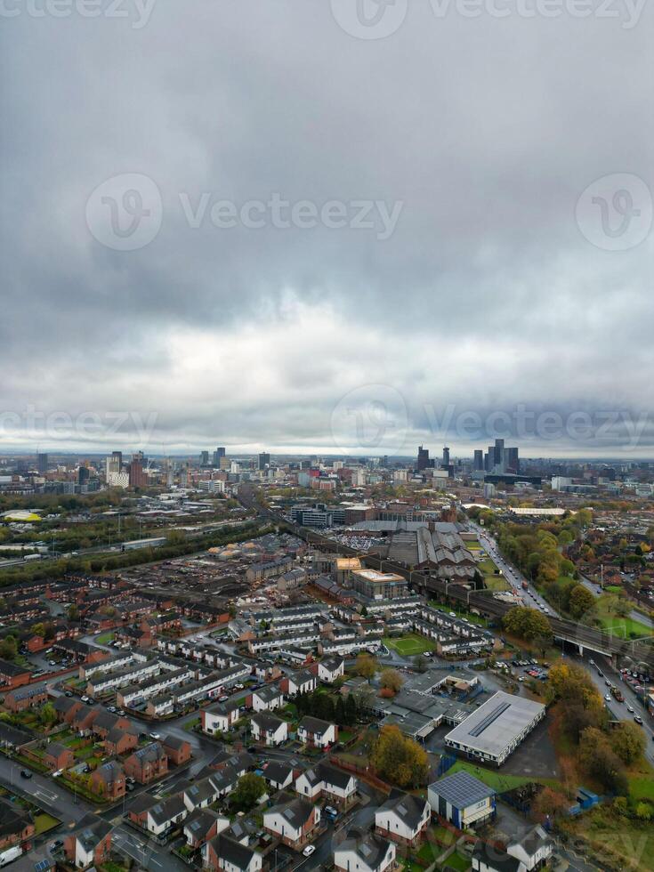 Aerial View of Manchester City During Autumn Season and Cloudy Day over England Great Britain. High Angle Drone's Camera Footage was Captured on October 29th, 2024 photo
