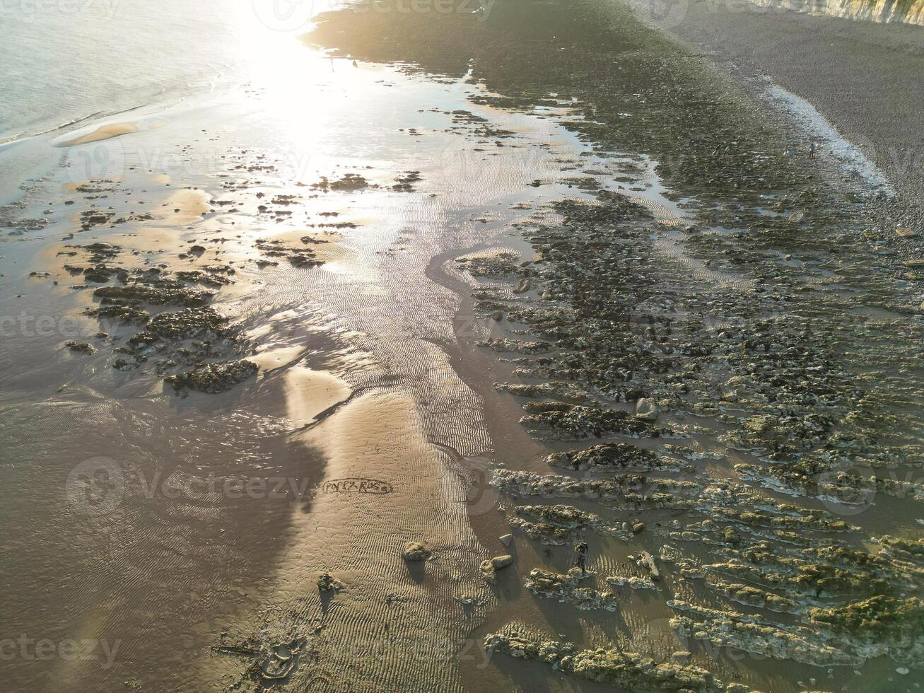 High Angle View of British Tourist Attraction of United Kingdom at Beachy Head headland Sea View and Ocean at Eastbourne, East Sussex, England. Drone's Camera Footage Was Captured on May 10th, 2024 photo