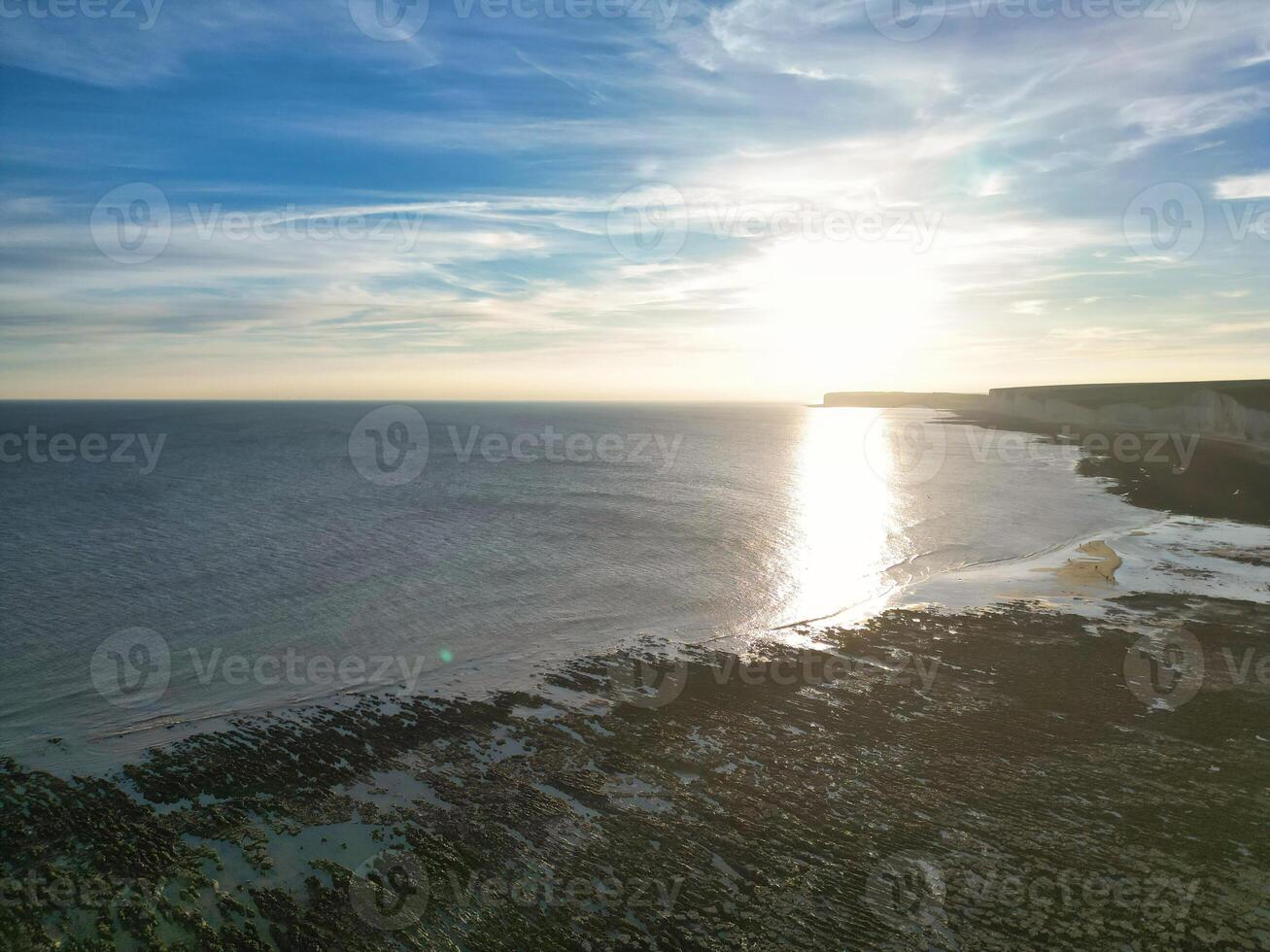 High Angle View of British Tourist Attraction of United Kingdom at Beachy Head headland Sea View and Ocean at Eastbourne, East Sussex, England. Drone's Camera Footage Was Captured on May 10th, 2024 photo