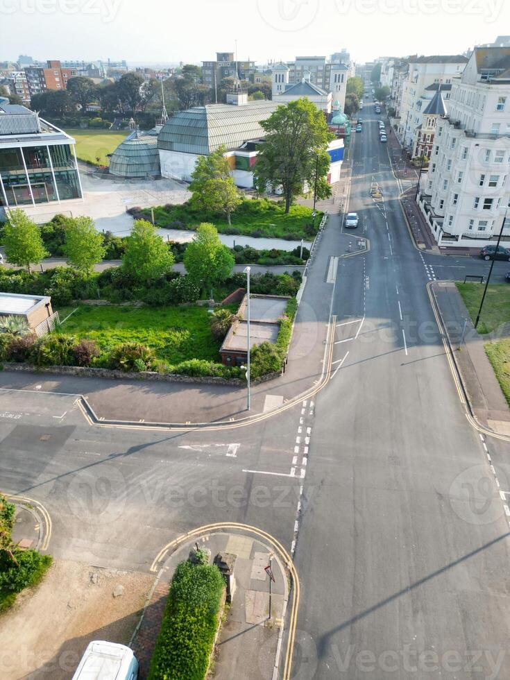 High Angle View of Historical Central Eastbourne Buildings and City of England, United Kingdom. Aerial Footage Was Captured with Drone's Camera During Windy Day on May 11th, 2024 photo