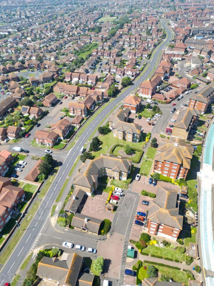 High Angle View of Historical Central Eastbourne Buildings and City of England, United Kingdom. Aerial Footage Was Captured with Drone's Camera During Windy Day on May 11th, 2024 photo