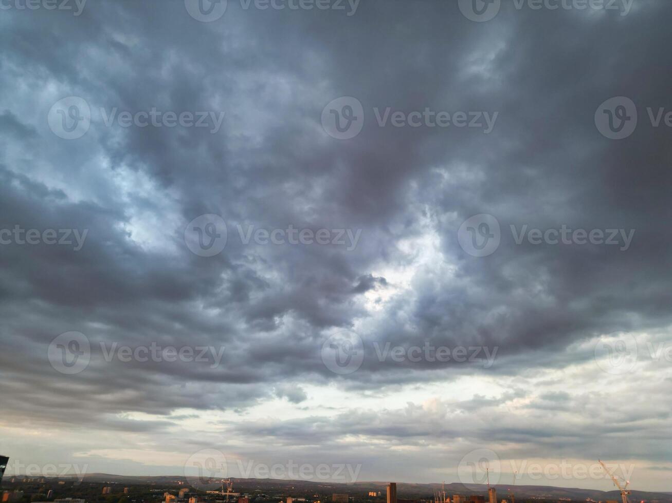 Unique and Dramatic Clouds and Sky over City of England Great Britain. Footage Was Captured with drone's Camera from High Altitude over Manchester City UK photo