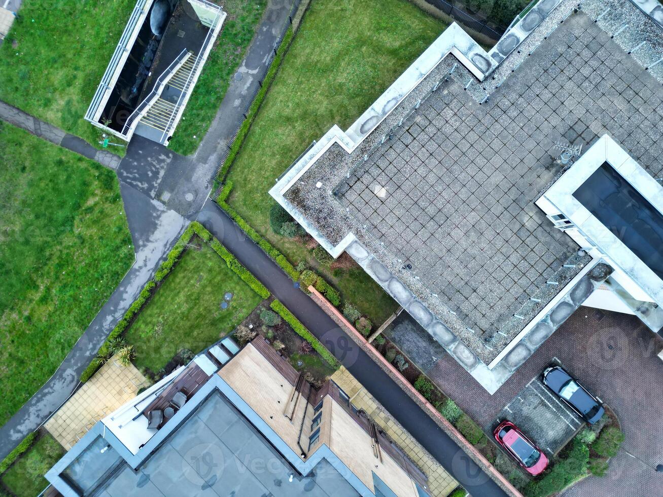 high Angle View of Buildings at Central Borehamwood London City of England United Kingdom. April 4th, 2024, Aerial View Was Captured with Drone's Camera From High altitude During Cloudy and Windy Day. photo