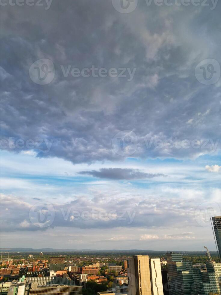 Aerial View of Greater Manchester City Centre and Tall Buildings During Golden Hour of Sunset. England UK. May 5th, 2024, High Angle Footage Was Captured with Drone's Camera photo