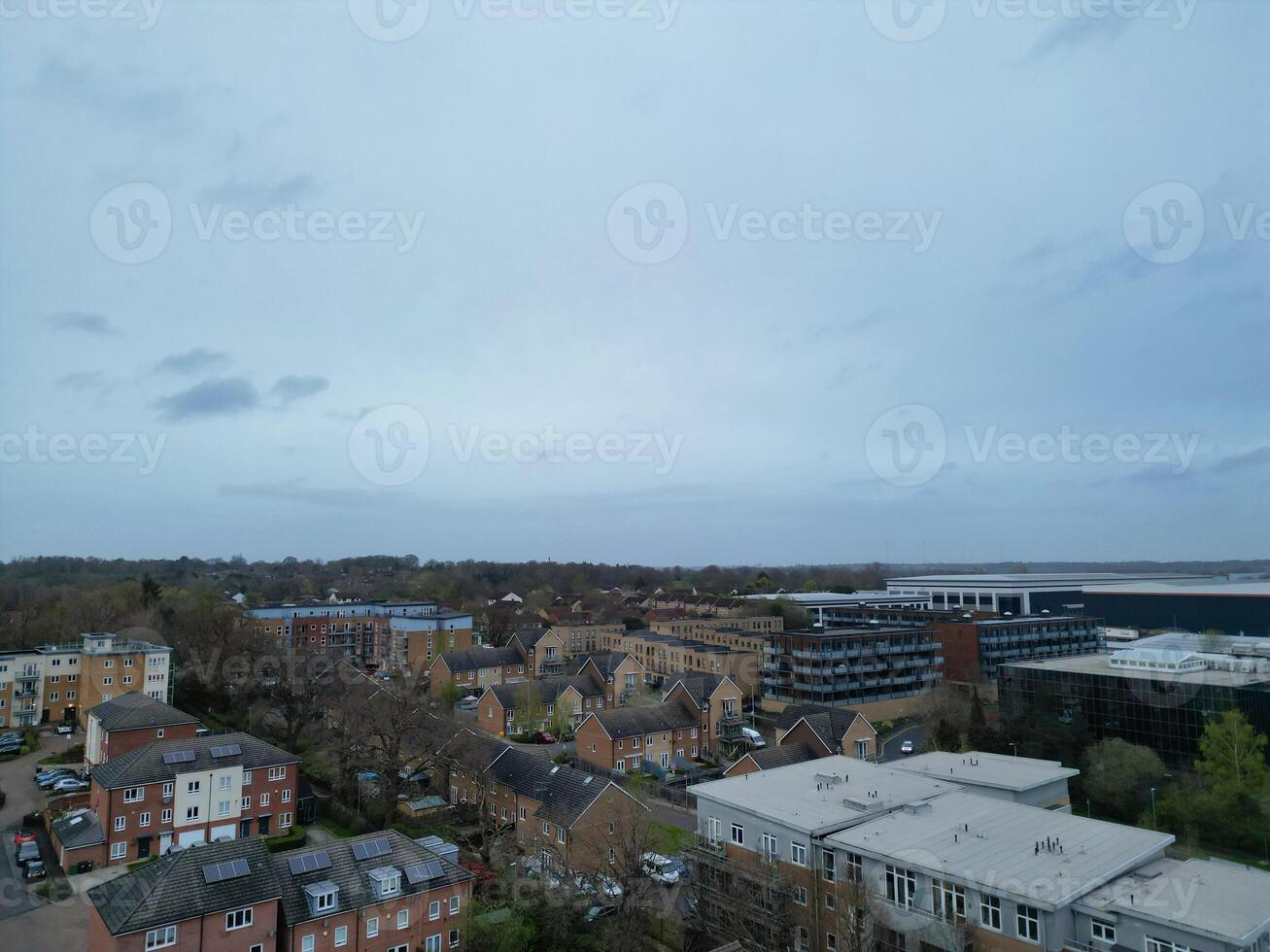 high Angle View of Buildings at Central Borehamwood London City of England United Kingdom. April 4th, 2024, Aerial View Was Captured with Drone's Camera From High altitude During Cloudy and Windy Day. photo