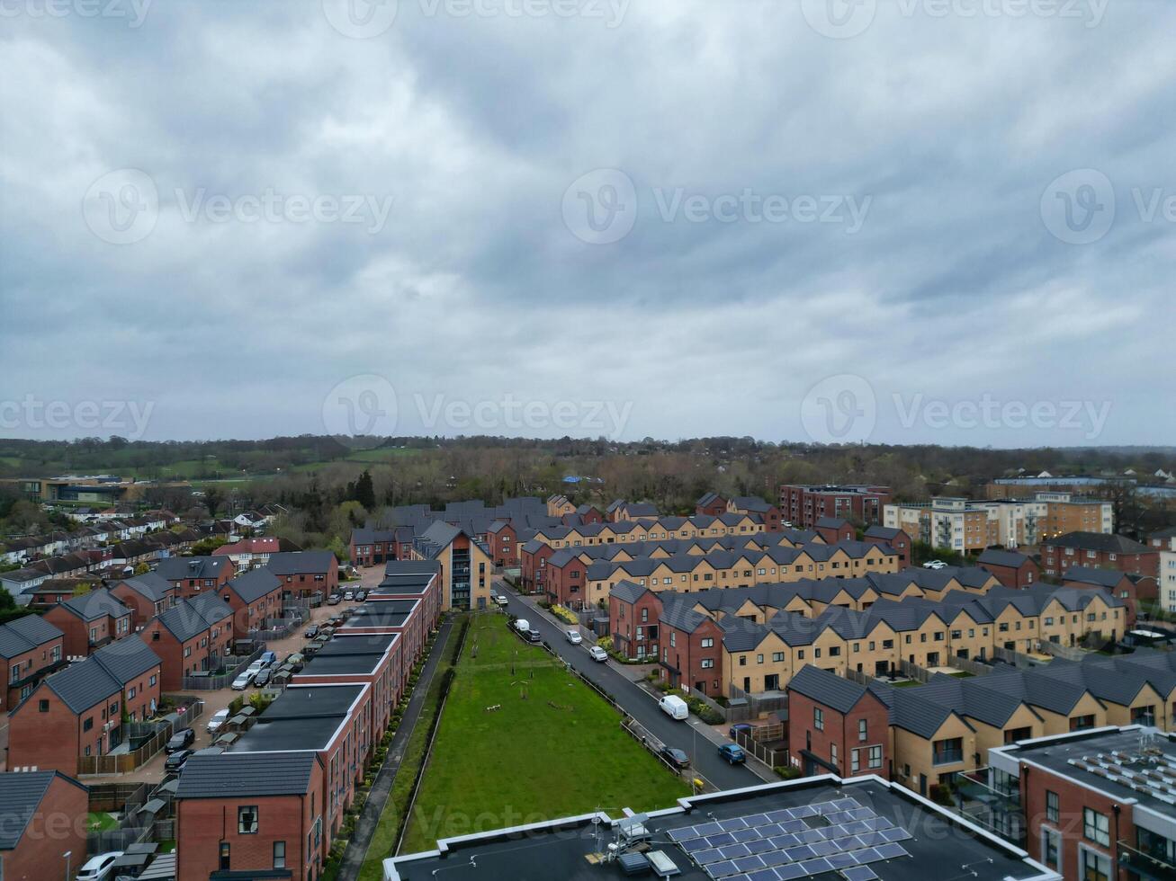 high Angle View of Buildings at Central Borehamwood London City of England United Kingdom. April 4th, 2024, Aerial View Was Captured with Drone's Camera From High altitude During Cloudy and Windy Day. photo