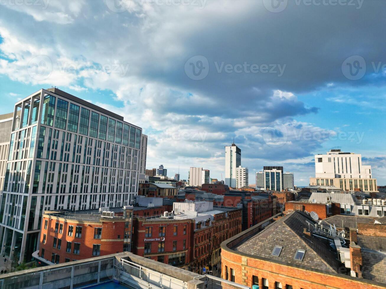 Aerial View of Greater Manchester City Centre and Tall Buildings During Golden Hour of Sunset. England UK. May 5th, 2024, High Angle Footage Was Captured with Drone's Camera photo