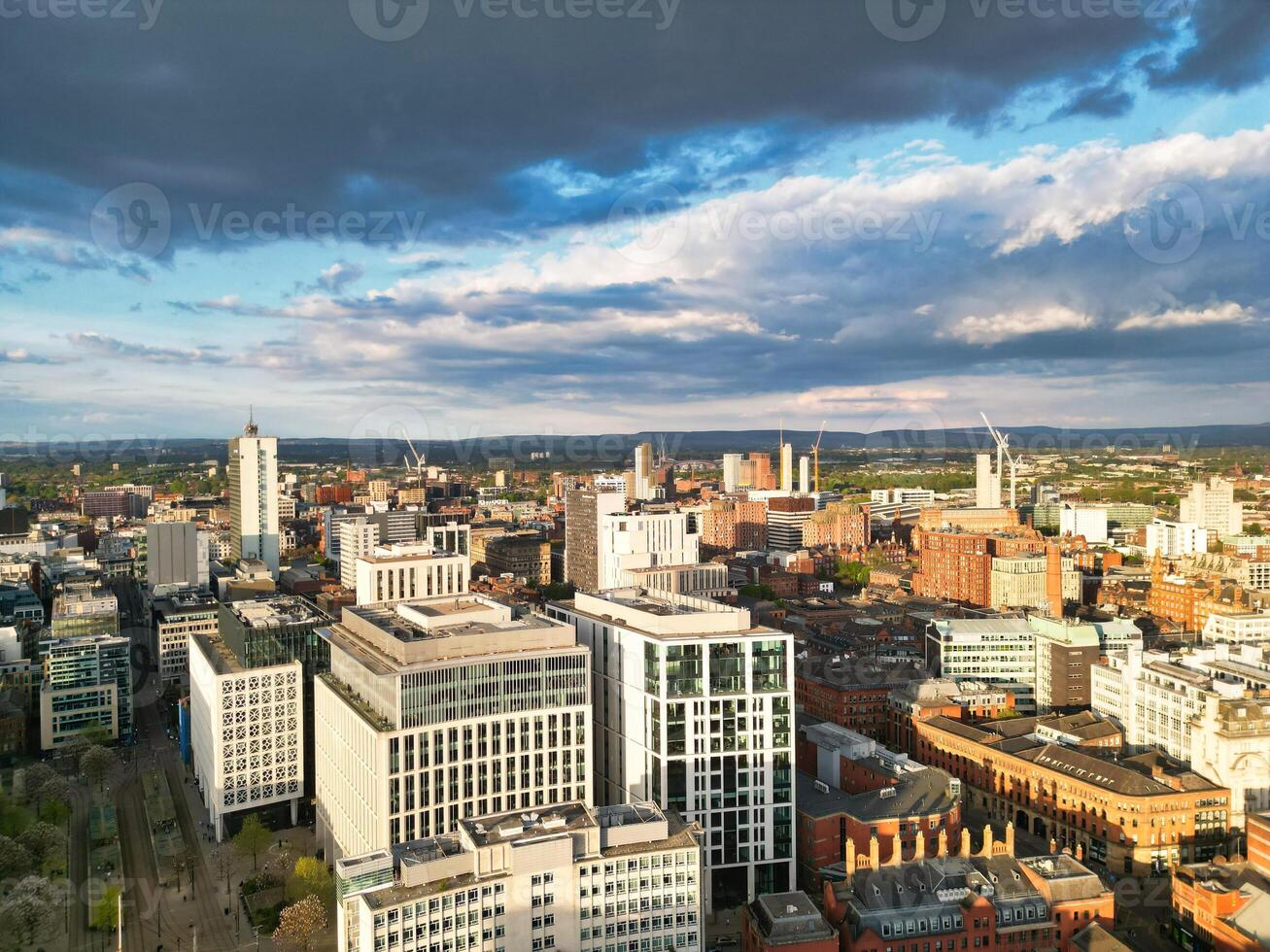 Aerial View of Greater Manchester City Centre and Tall Buildings During Golden Hour of Sunset. England UK. May 5th, 2024, High Angle Footage Was Captured with Drone's Camera photo
