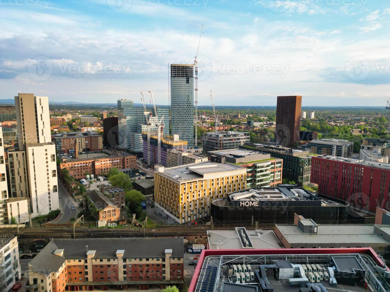 Aerial View of Greater Manchester City Centre and Tall Buildings During Golden Hour of Sunset. England UK. May 5th, 2024, High Angle Footage Was Captured with Drone's Camera photo