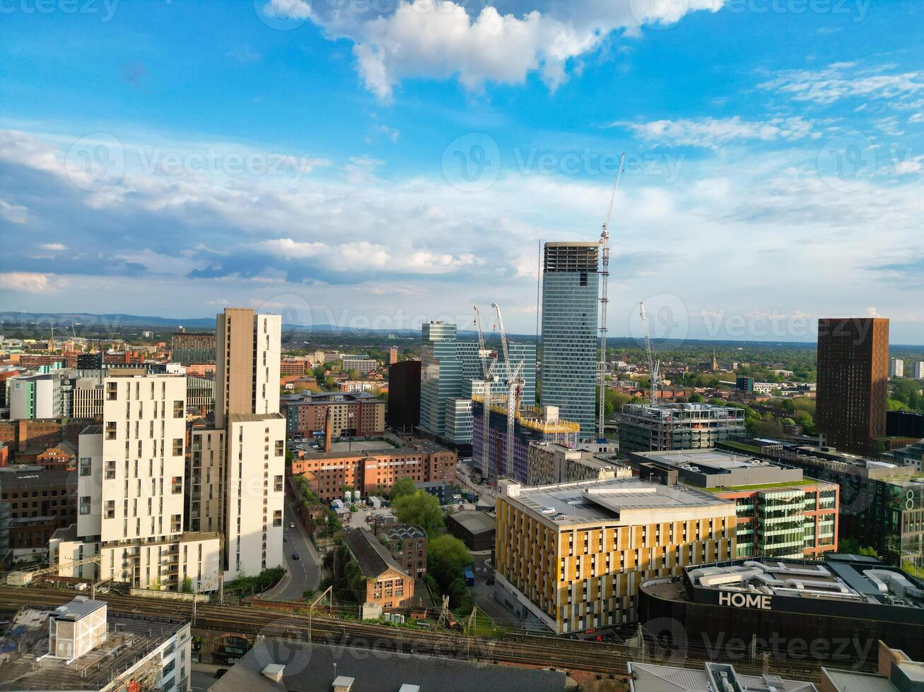Aerial View of Greater Manchester City Centre and Tall Buildings During Golden Hour of Sunset. England UK. May 5th, 2024, High Angle Footage Was Captured with Drone's Camera photo