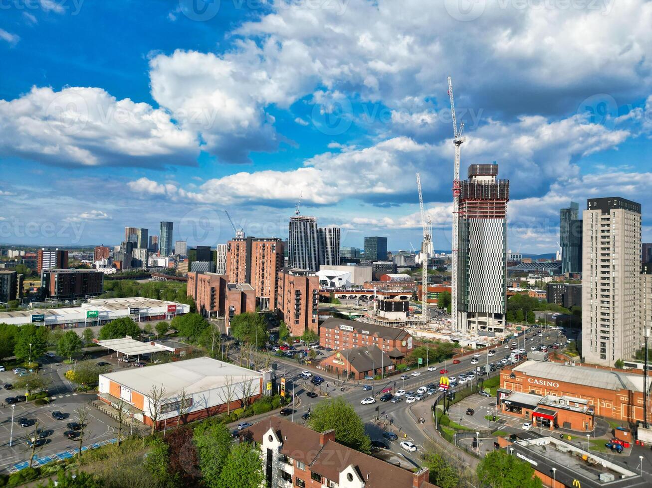 Aerial View of Greater Manchester City Centre and Tall Buildings During Golden Hour of Sunset. England UK. May 5th, 2024, High Angle Footage Was Captured with Drone's Camera photo