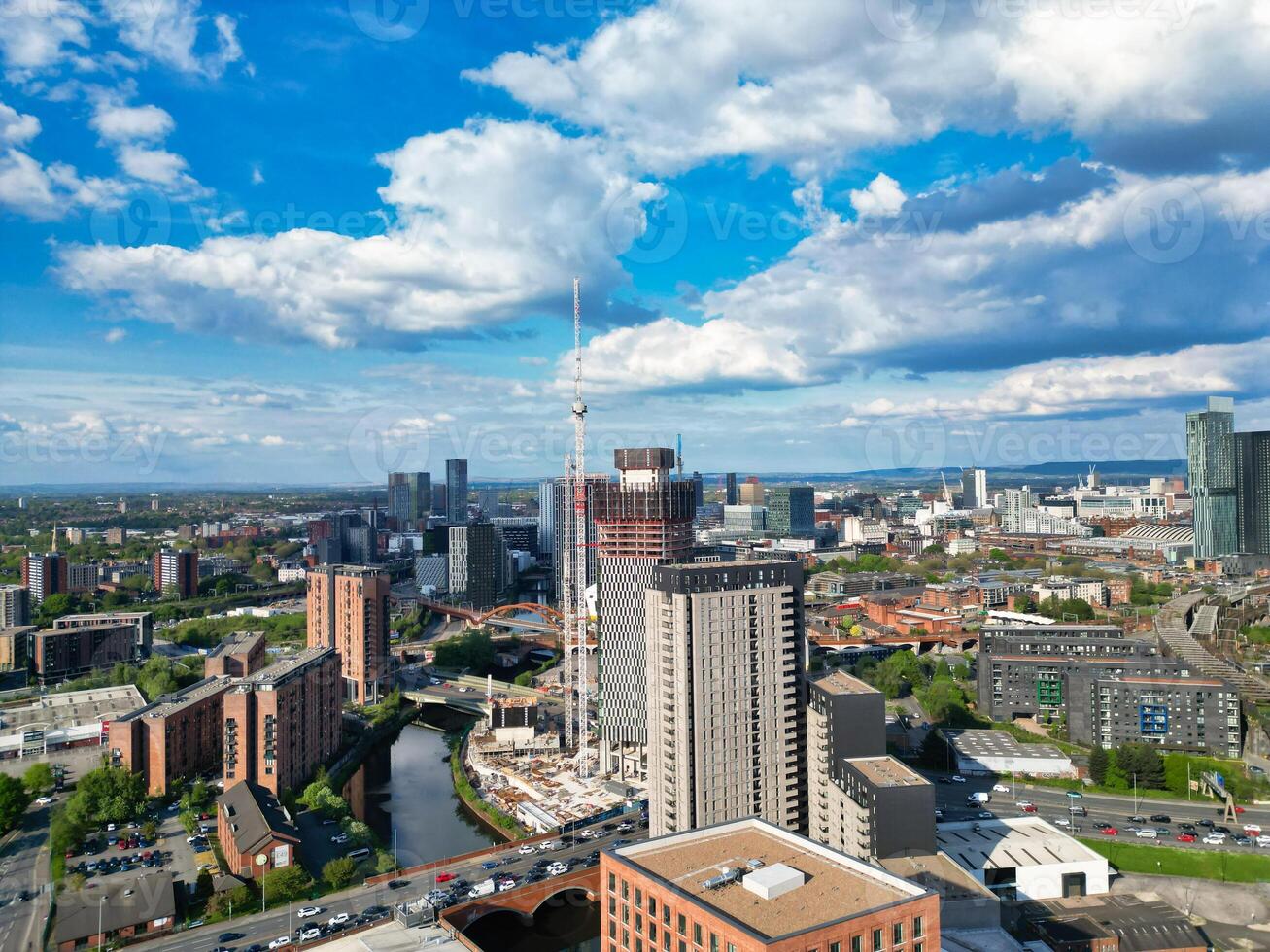 Aerial View of Greater Manchester City Centre and Tall Buildings During Golden Hour of Sunset. England UK. May 5th, 2024, High Angle Footage Was Captured with Drone's Camera photo