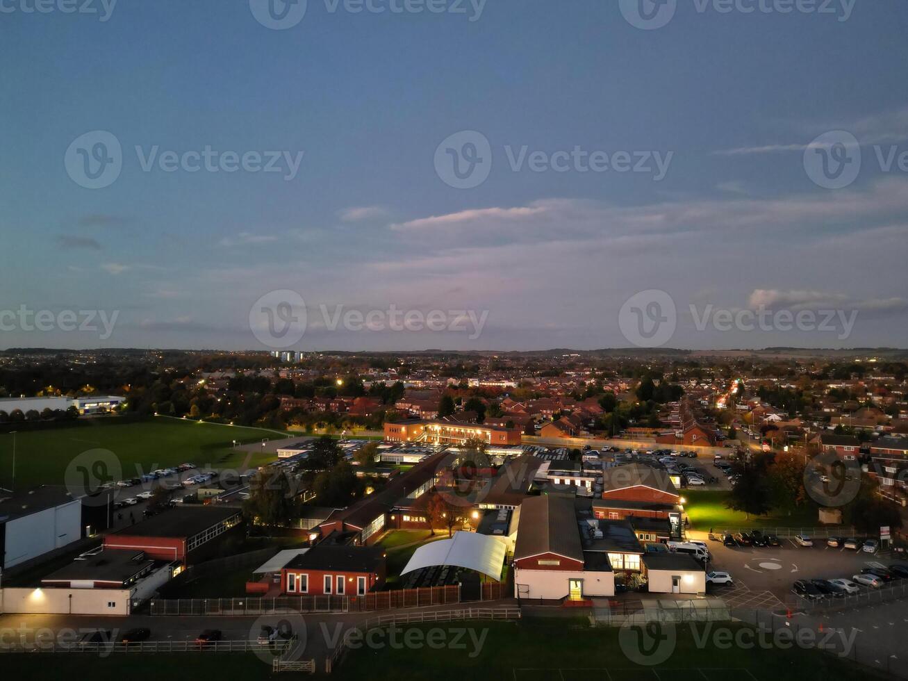 Most Beautiful High Angle View of Illuminated Luton City of England UK at Just After Sunset and Full Moon Night. Aerial Footage Was Captured with Drone's Camera on October 17th, 2024 photo