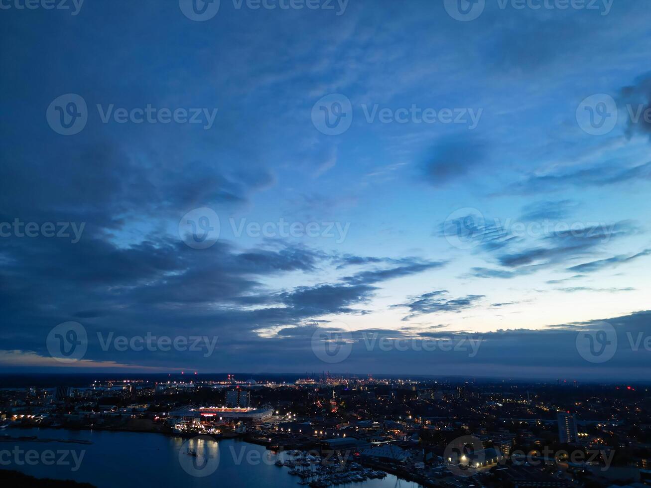 Aerial View of Illuminated Southampton Docks and Port City Centre During Dark Night. England United Kingdom. High Angle Drone's Camera Footage Captured from High Altitude on May 16th, 2024 photo