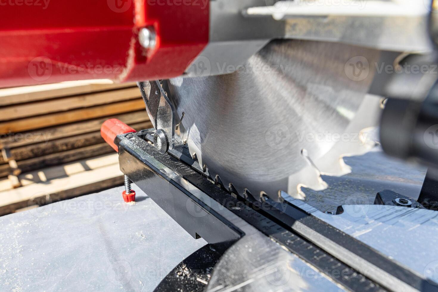 Close-up of industrial metal cutting tool. Sliding compound mitre saw or industrial saw in steel and metal production factory. Wood and sawing machine construction ideas concept. photo