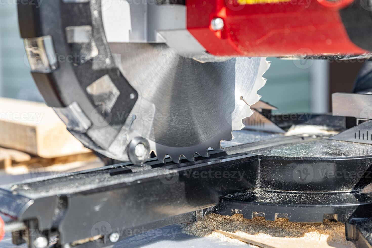 Miter saw, construction tool ,carpentry home renovation backgrounds, copy space image. Miter saw with a protective screen. Safe equipment for the furniture and construction industry. Close-up. photo