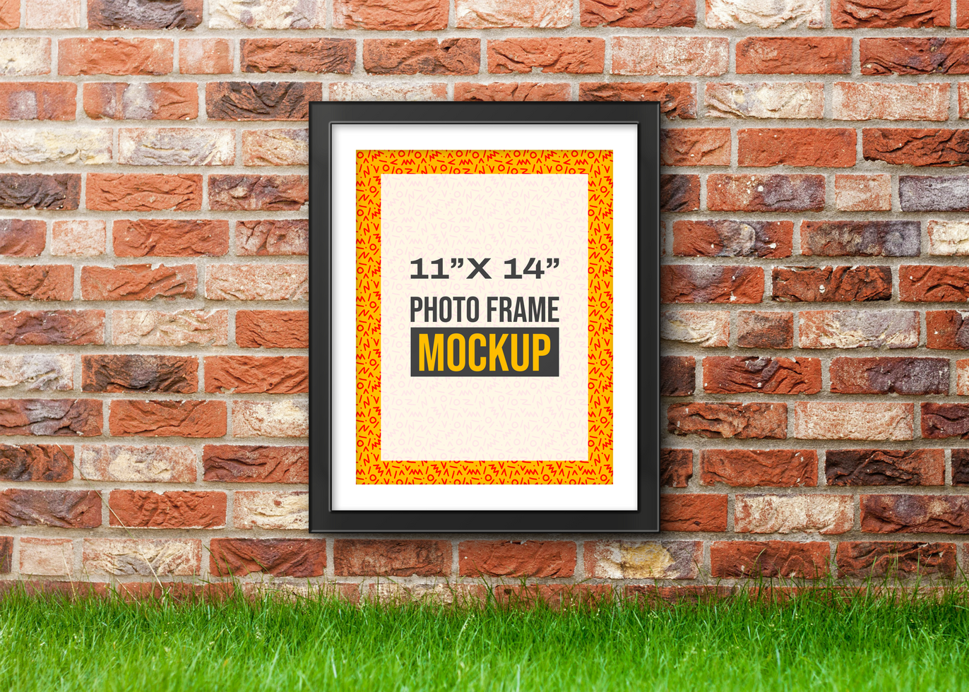 Photo Frame mockup hanged on brick wall psd