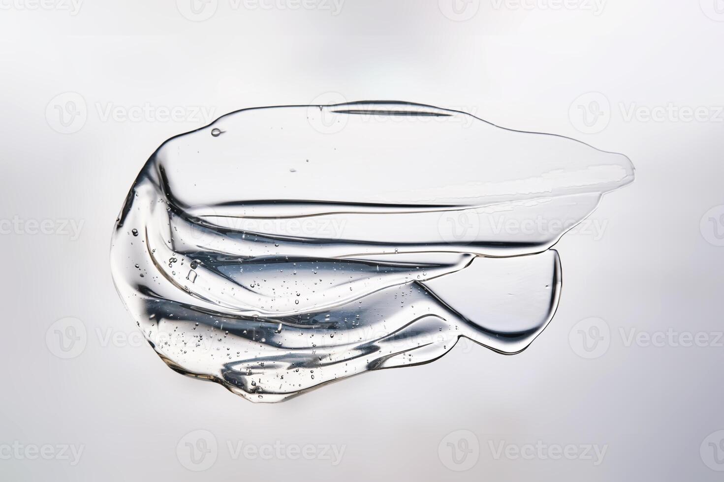 Close-up of a cosmetic bottle with a pipette showing the texture of the serum. photo