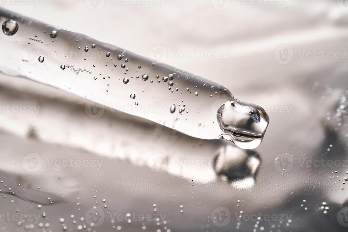 Dropper pipette with delicious serum with bubbles on the gel texture. photo