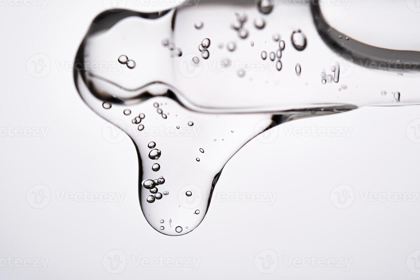 Dropper pipette with delicious serum with bubbles close-up. photo