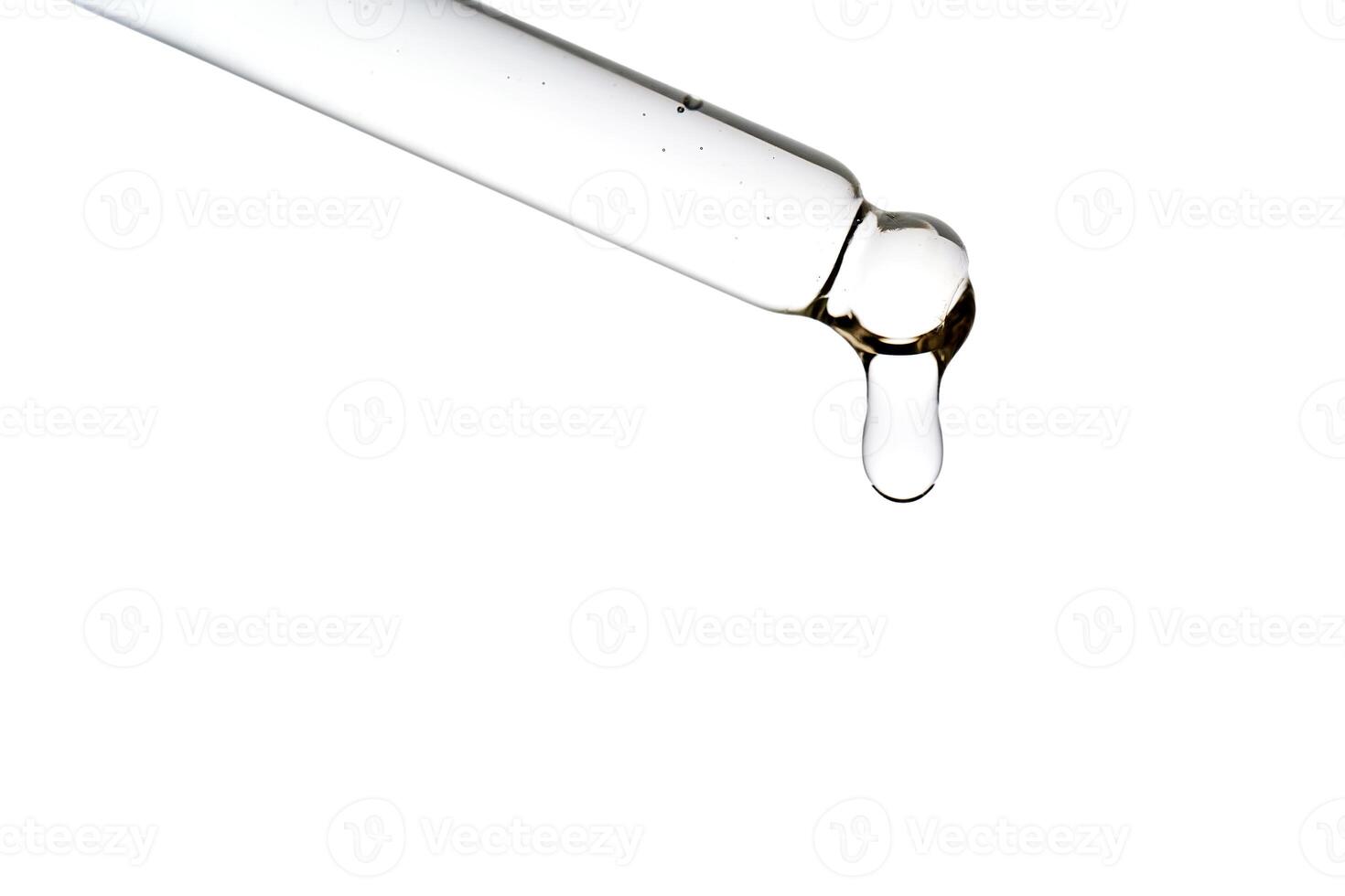 Dropper pipette with delicious serum with bubbles close-up. photo