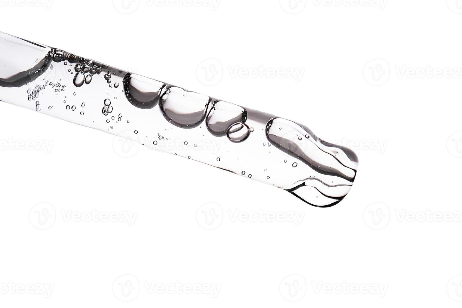 Dropper pipette with delicious serum with bubbles close-up. photo