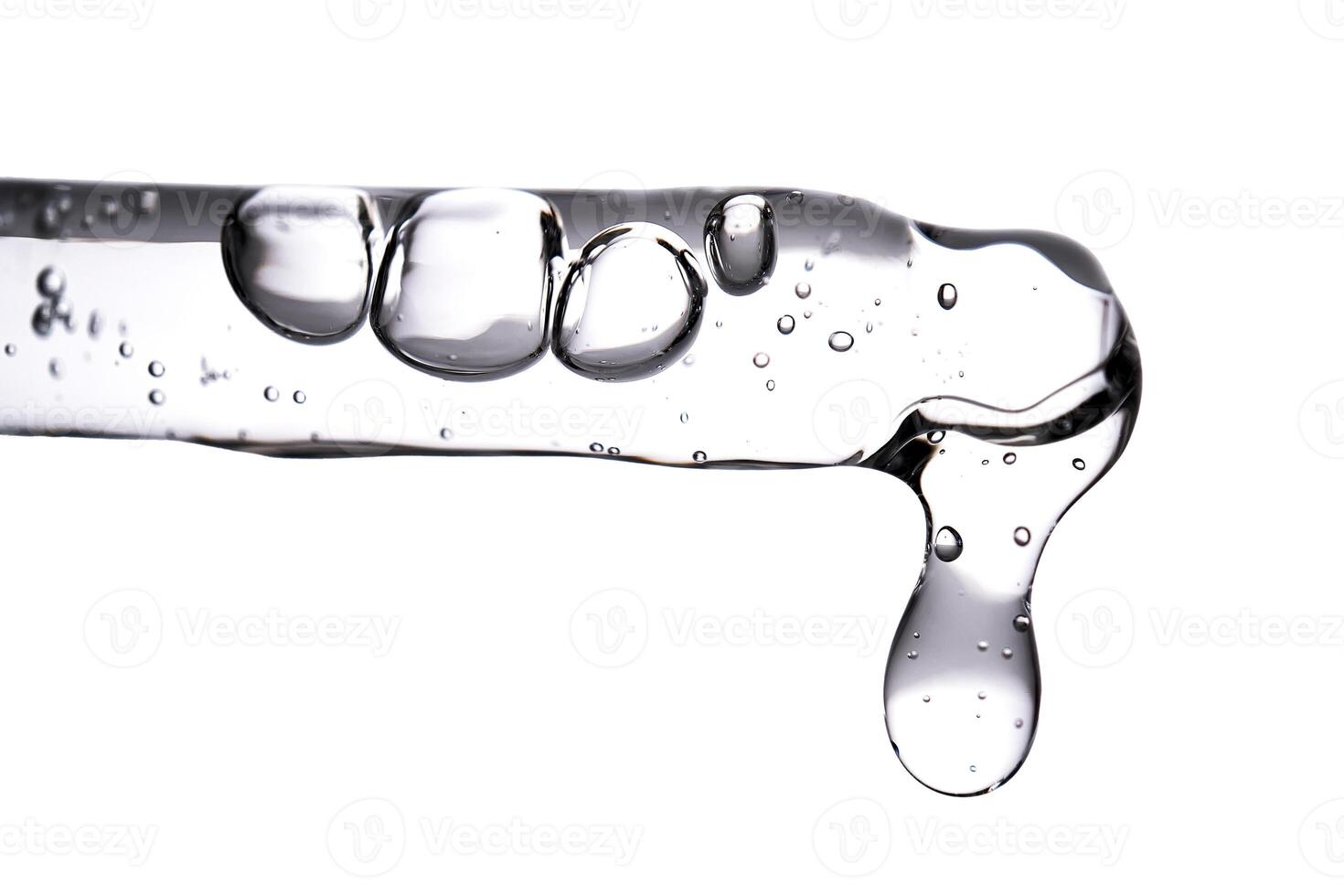 Dropper pipette with delicious serum with bubbles close-up. photo