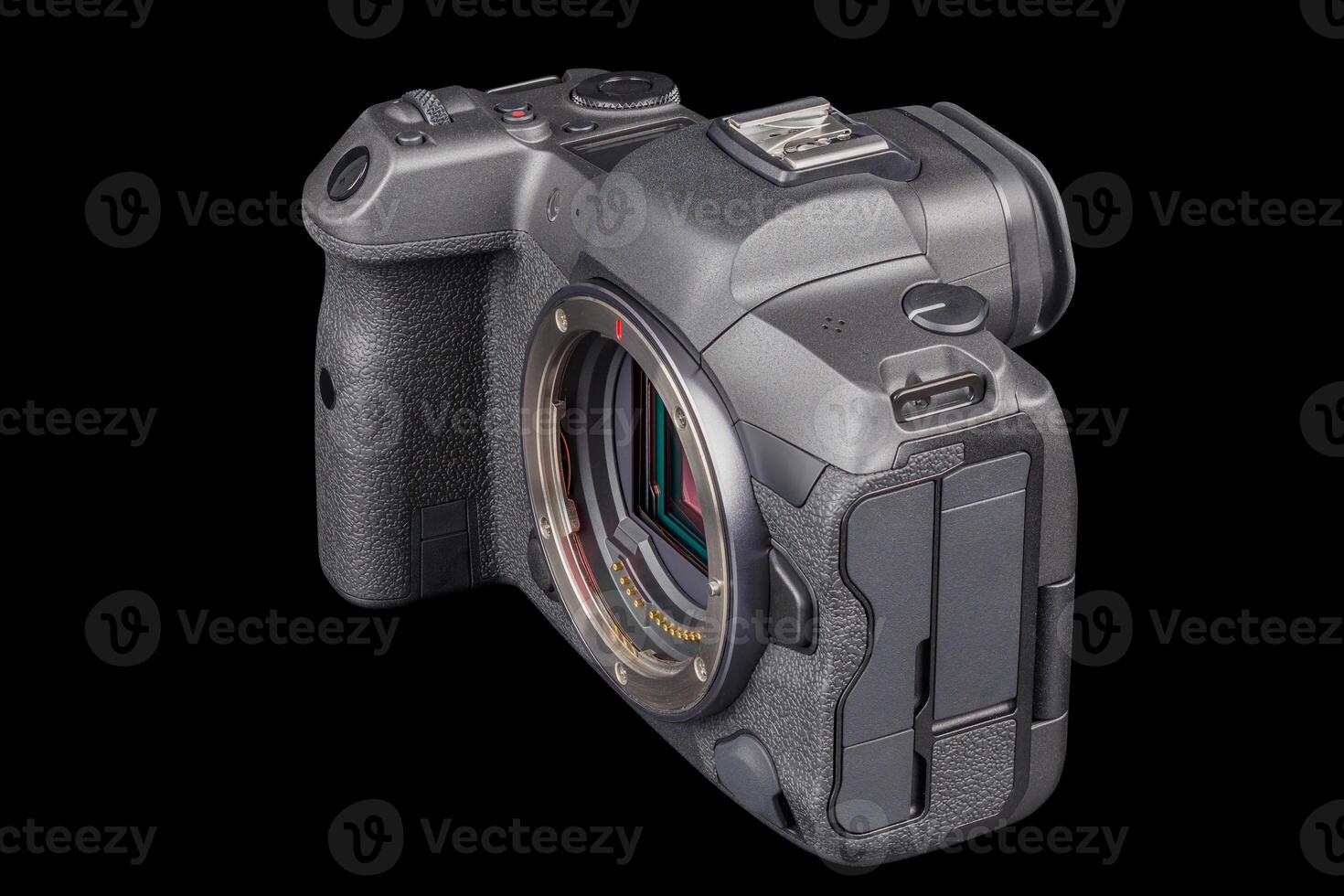 black professional mirrorless camera body isolated on black background photo