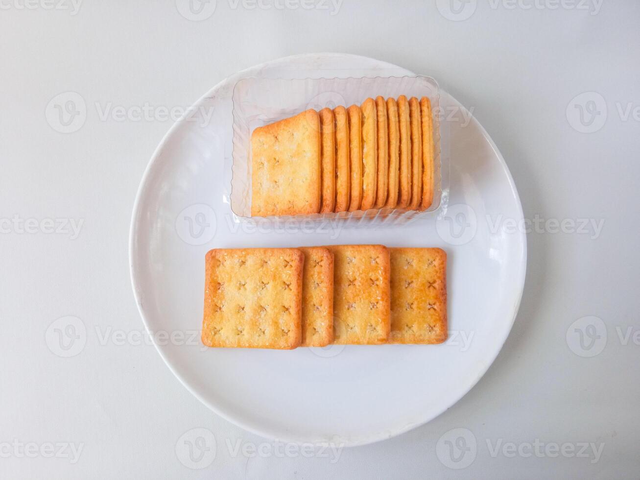 Sugar coated biscuits, also known as malkist, sweet and crispy. Served on white plate photo