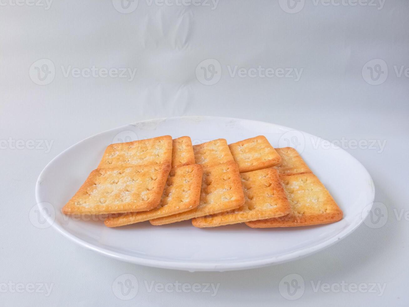 Sugar coated biscuits, also known as malkist, sweet and crispy. Served on white plate photo
