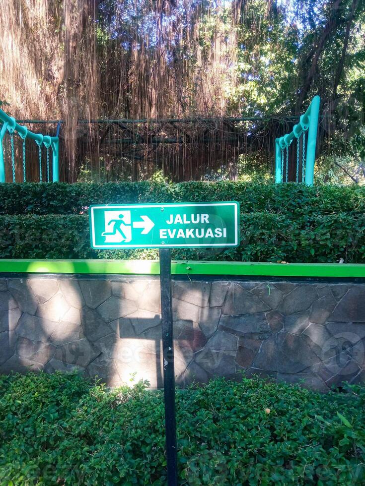 evacuation route sign in a park photo