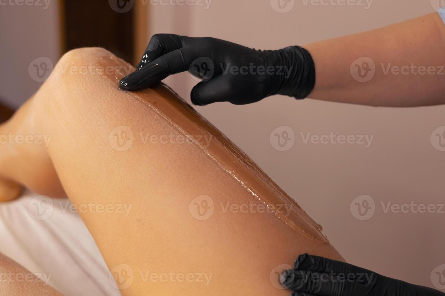 Professional waxing treatment in a serene spa environment during a relaxing session photo