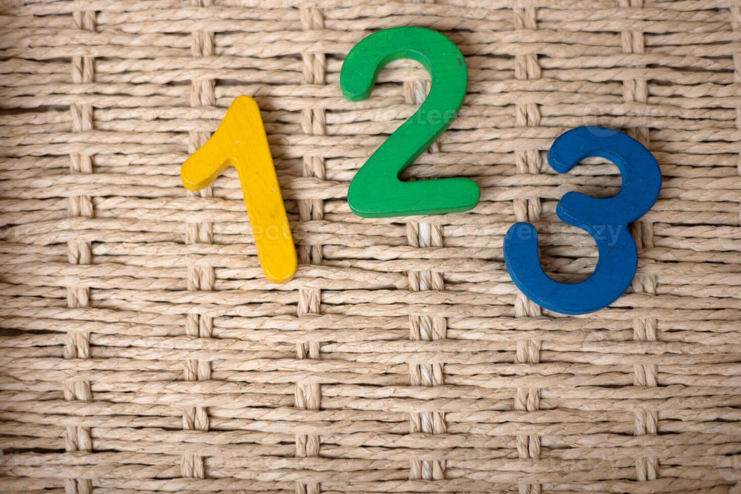 Close-up wooden figure numbers on a white blurred background photo