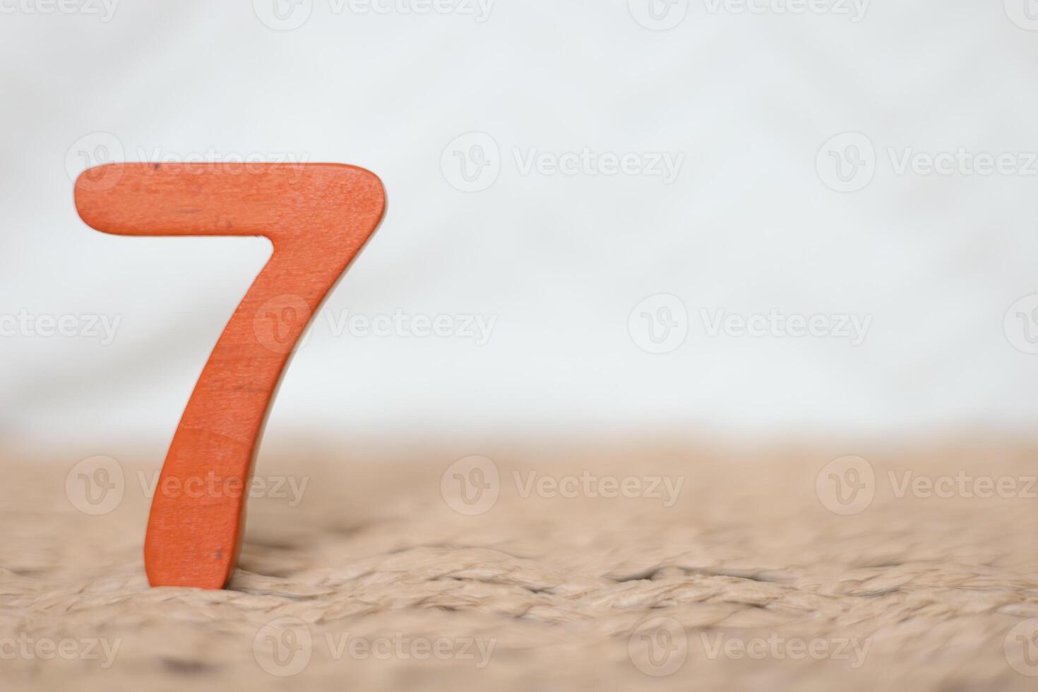 Close-up wooden figure number on a white blurred background photo