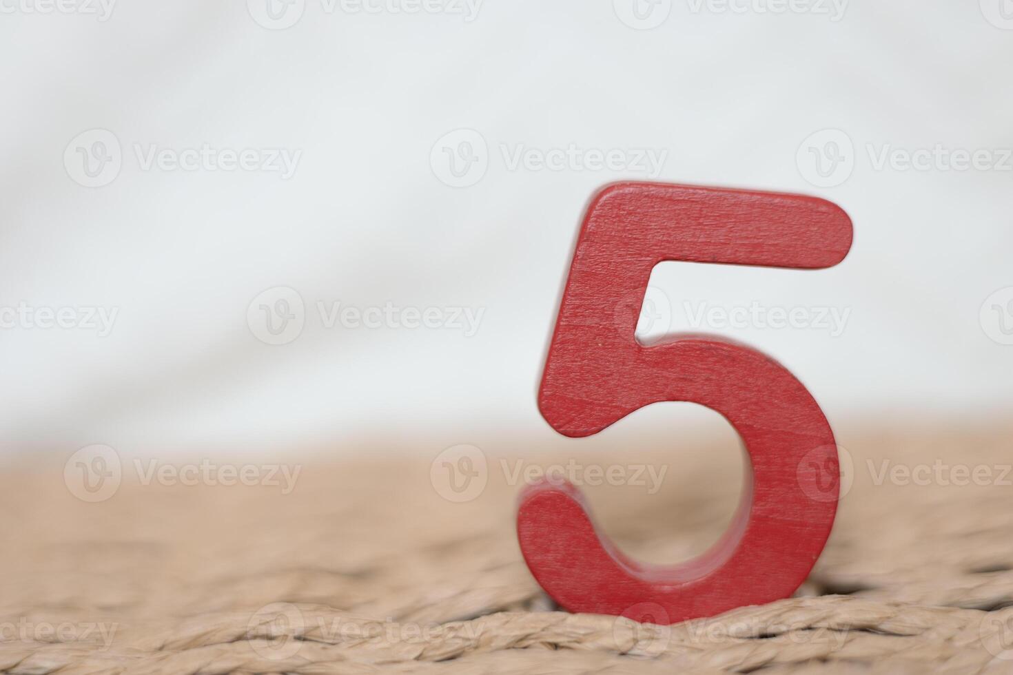 Close-up wooden figure number on a white blurred background photo