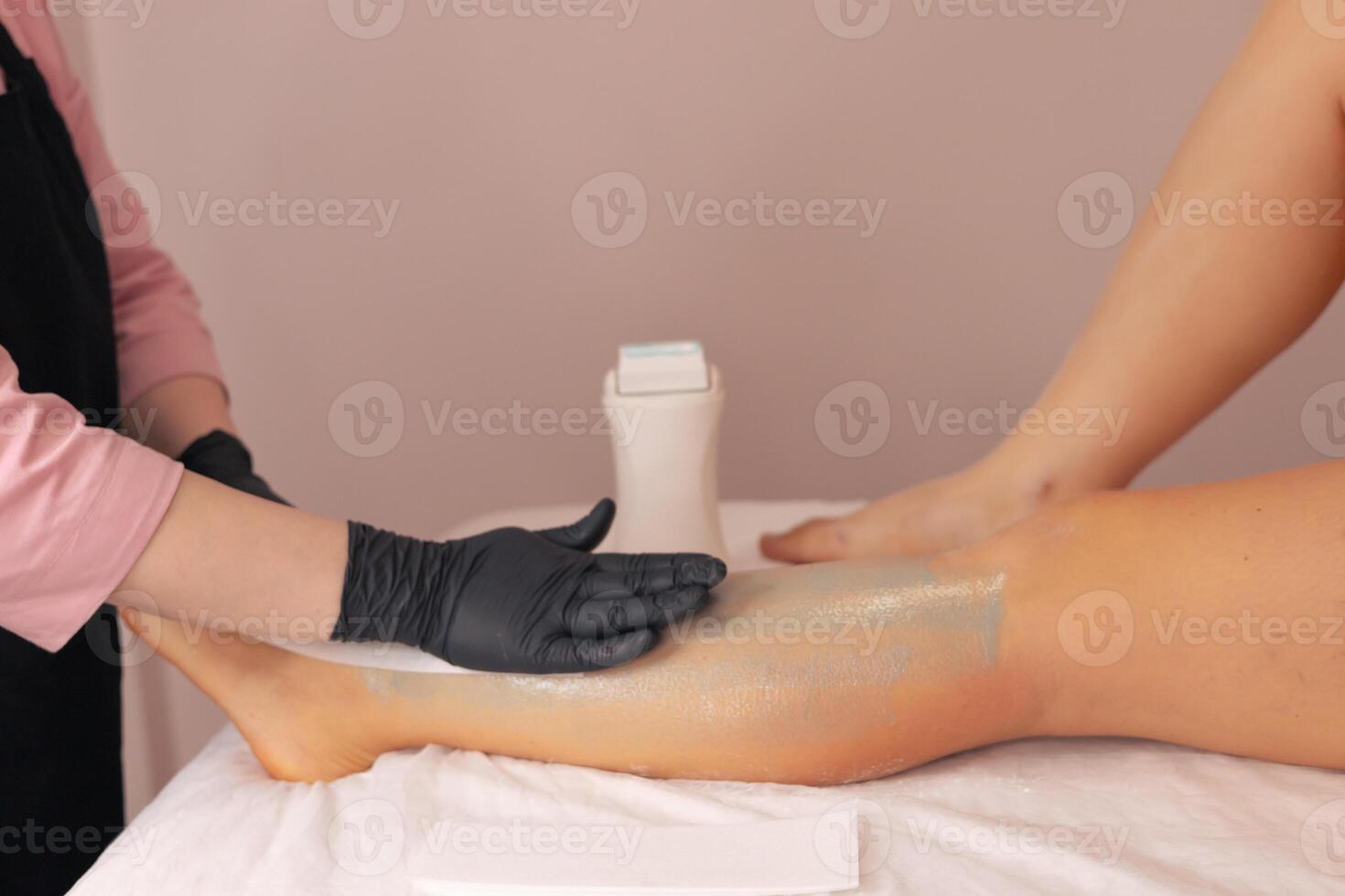 Professional waxing session for smooth skin in a serene salon environment photo