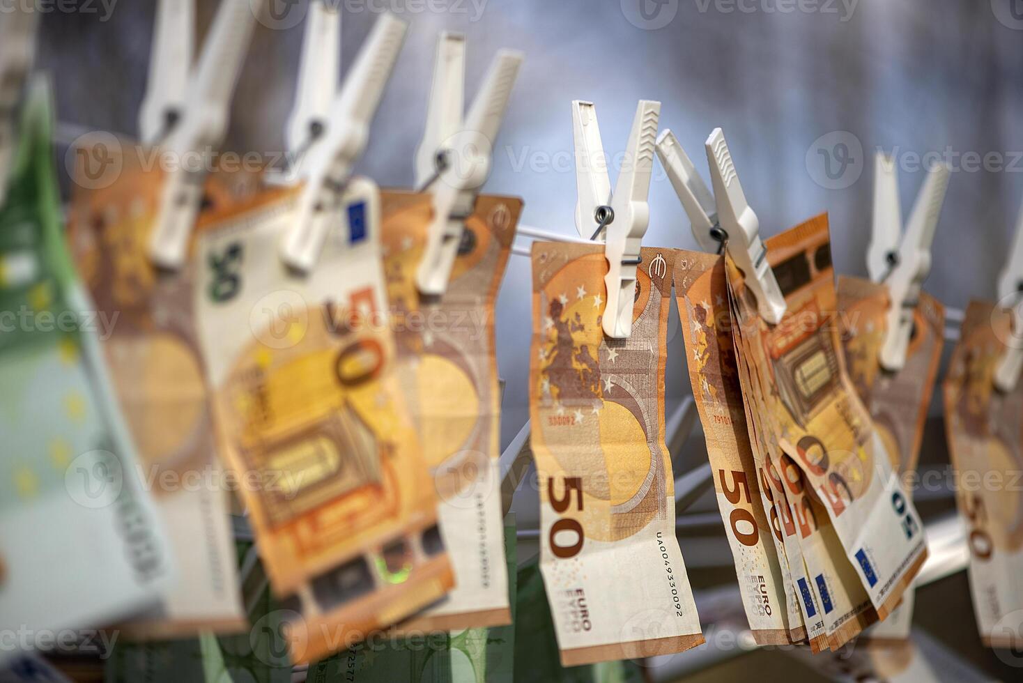Washed Euro paper bills. Drying euro on a string.Money laundering photo