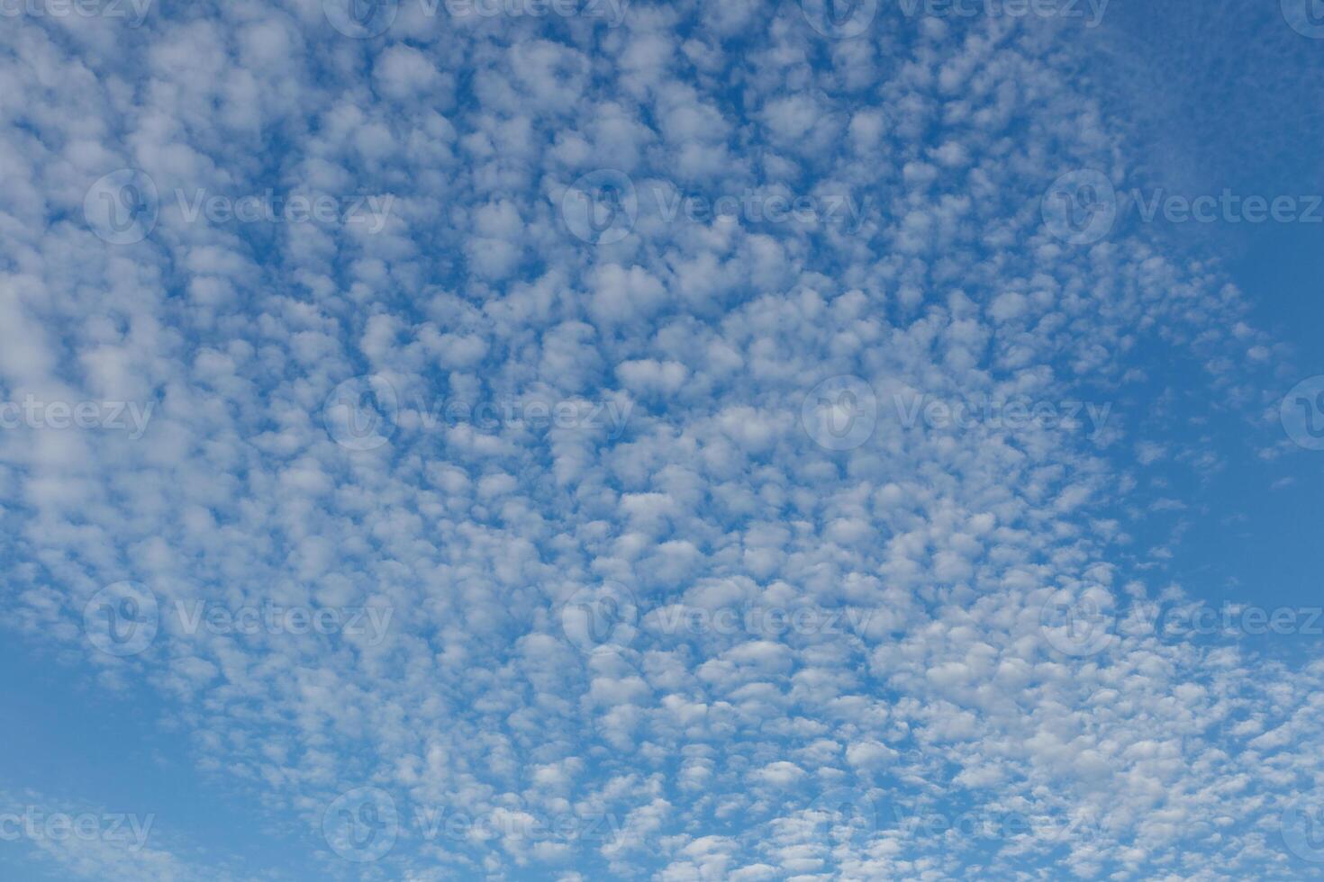 Blue sky natural background. White clouds in the blue sky photo