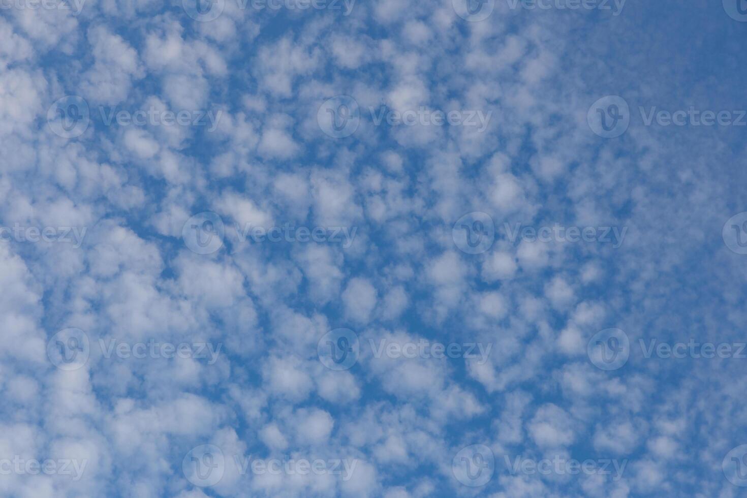 Blue sky natural background. White clouds in the blue sky photo