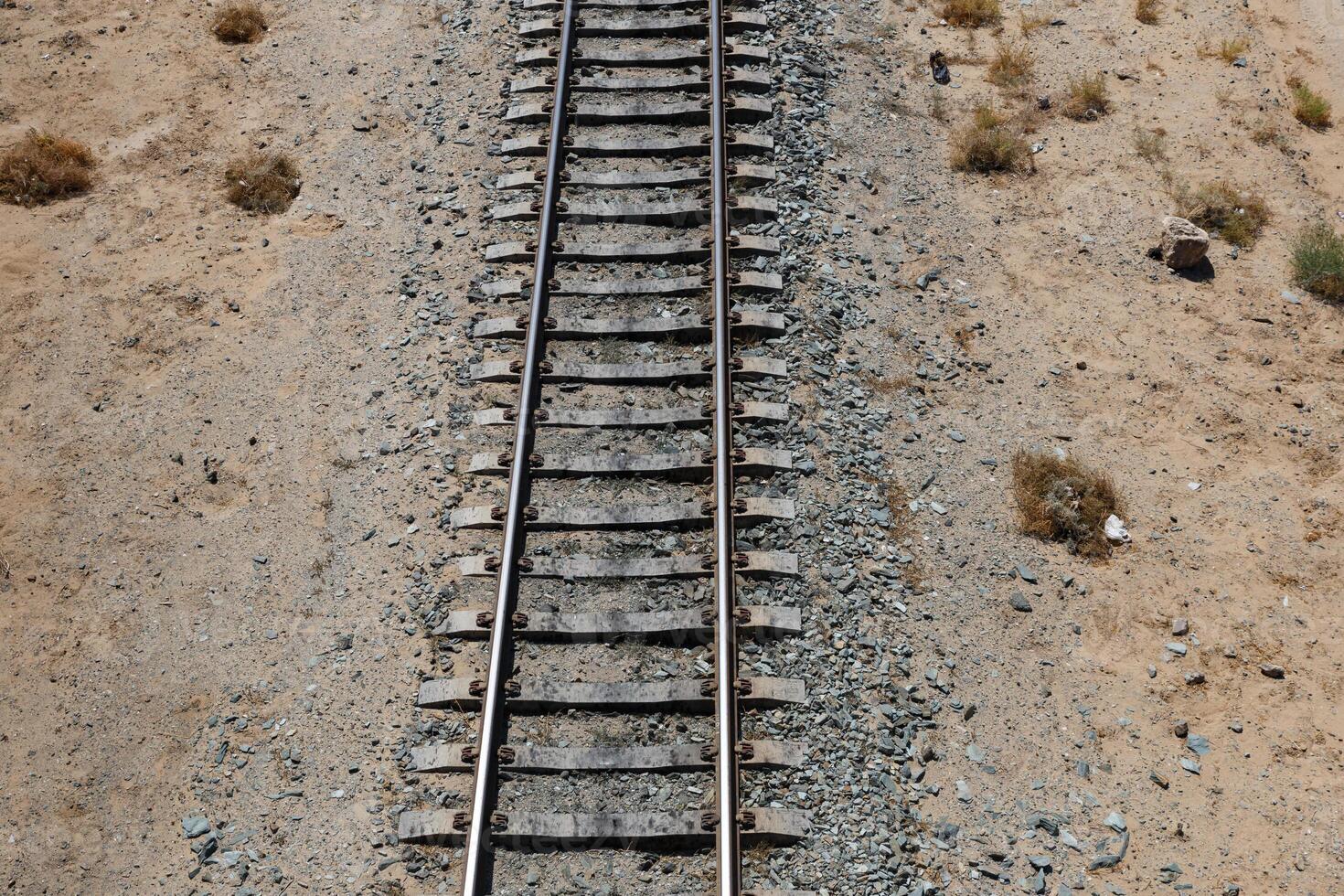 Railway tracks in the desert of Uzbekistan. View from above. The concept of travel photo